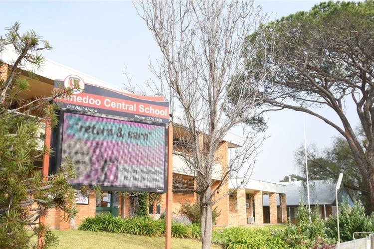 Photo of the front of Dunedoo Central School with a digital sign in the foreground