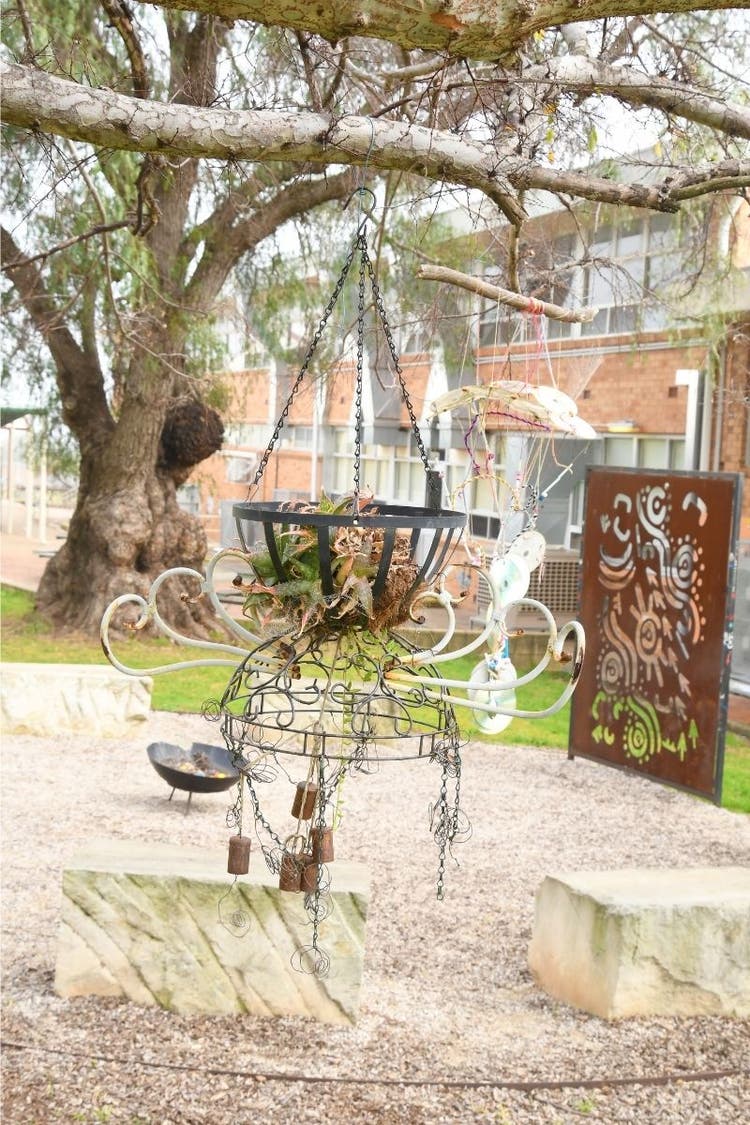 Windchime made from recycled materials hanging in the playground